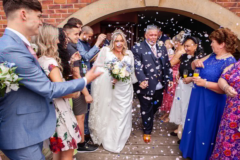 Leaving the Dalmeny Hotel after the ceremony to be greeted by family and friends for traditiional confetti throwing