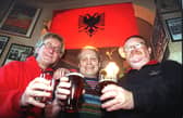 The Wheatsheaf Hotel on Talbot Road declared itself the first Kosovan Embassy, after regulars travelled to the region with a company building army camps.
Pictured under the Kosovan flag are L-R: pub landlord and Kosovan 'Ambassador' Barrie Eastwood, and 'envoys' Ian Bootham and Syd Marshall. PIC BY ROB LOCK