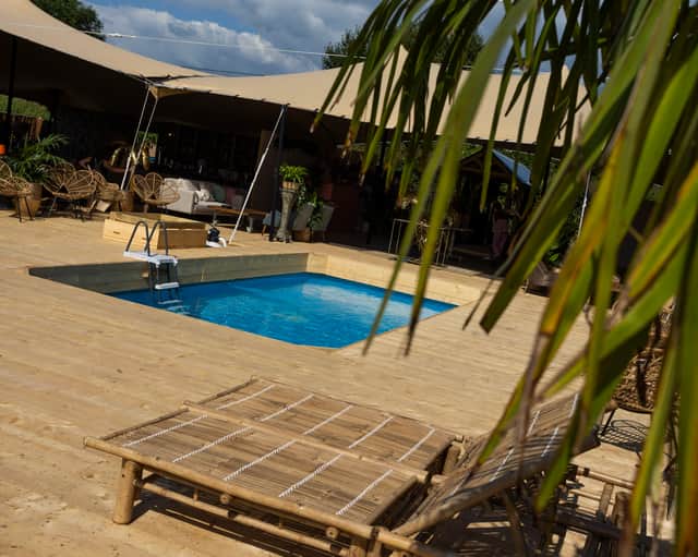 A glamping site is providing posh accommodation for fussier Glastonbury Festival goers - with a swimming pool on-site.