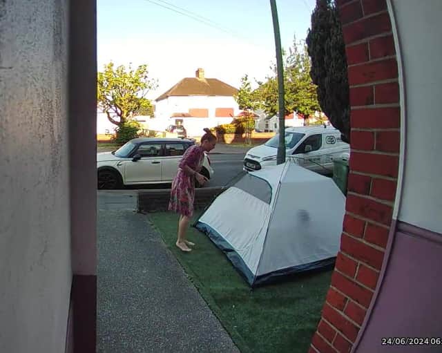 Video grab of the moment a mum was baffled when she looked outside and found a stranger had pitched a tent in her front garden overnight