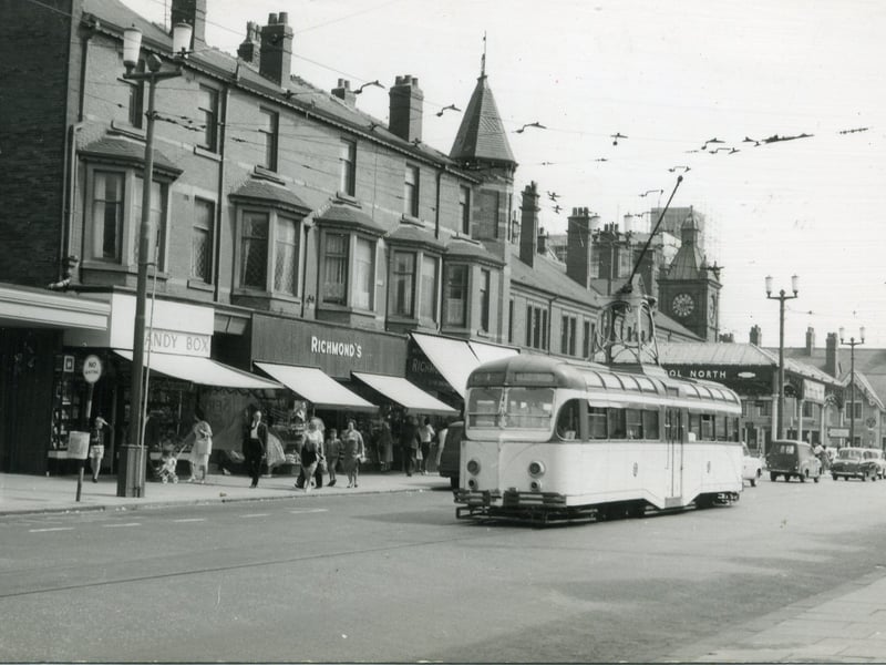 Dickson Road loooking towards Talbot Road, showing The Talbot Hotel on the far right, Blackpool North railway station can be seen behind the tram. The canopy of the Odeon Cinema can be seen on the far left.