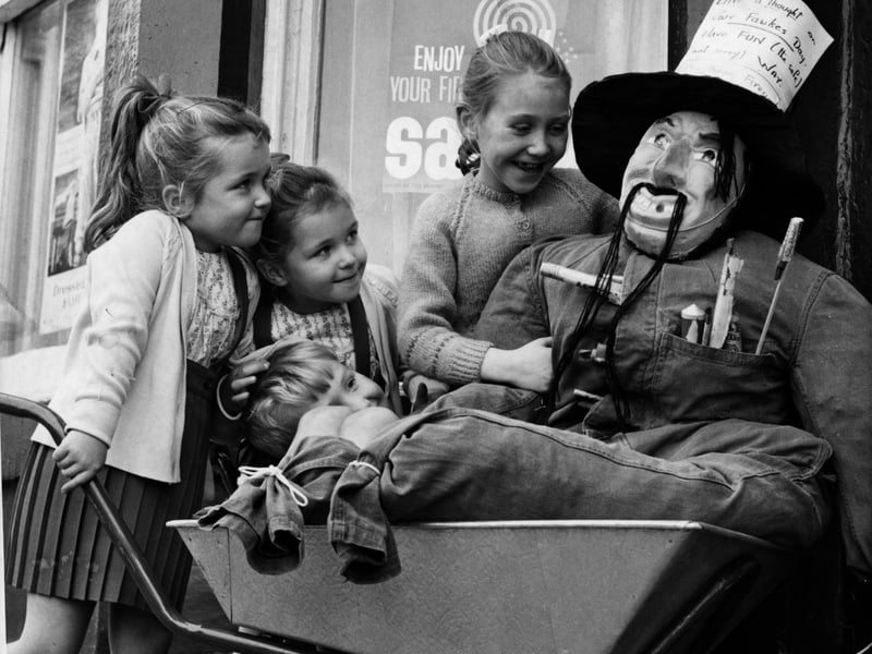 Children view a Guy Fawkes outside the "House Of Peril" exhibition in Blackpool in 1964. The exhibition was promoting safety on bonfire night