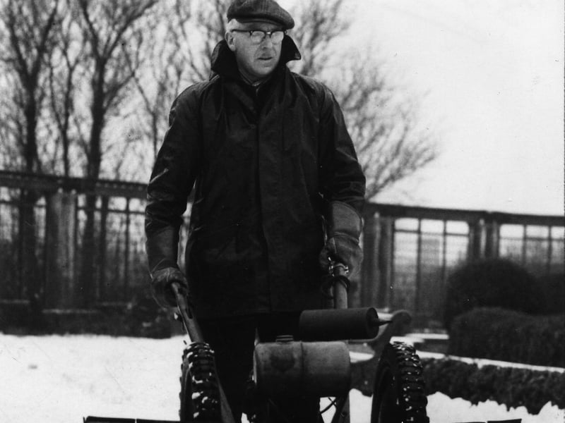 A member of the Blackpool Parks Department operating a mechanical snow plough in Stanley Park, 1963