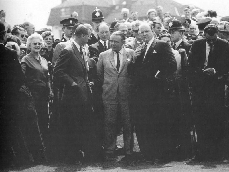Prince Philip in conversation with Henry Longhurst at the Nine Nations Golf Tournament at Blackpool in 1963.
