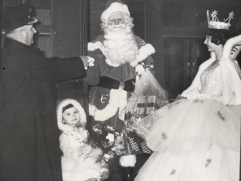 Welcome to Blackpool-The station master at North Station Mr T Davidson welcomes Father Christmas on his arrival by train on his way to R.H.O Hills at Blackpool 1963
