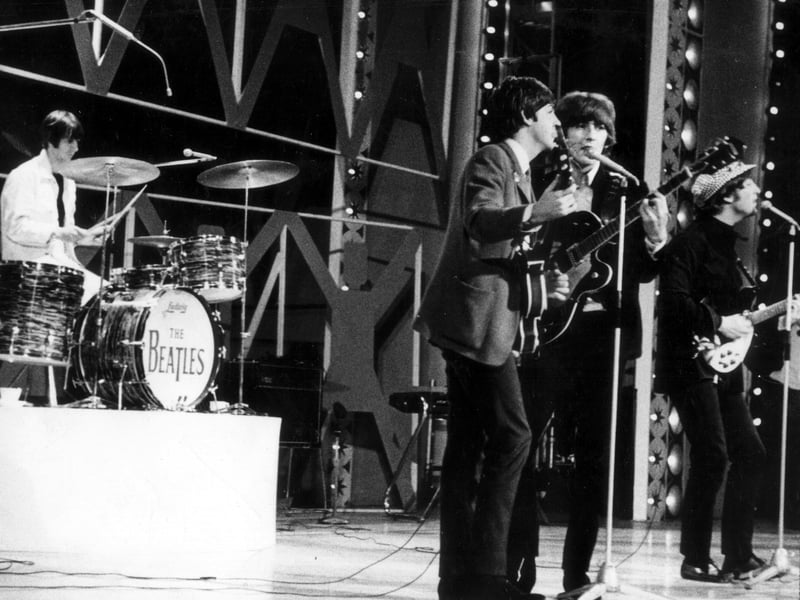 The Beatles on the stage of the ABC Theatre which opened in May 1963. They played live Sunday night TV concerts there including the debut of "Yesterday" by Paul McCartney on 1st August 1965 . The world's most recorded song was sung solo to the backing of his own acoustic guitar. This picture is believed to be the Big Night Out TV programme in July 1964