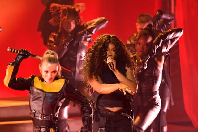 US singer SZA performs on stage during the 66th Annual Grammy Awards - many Glastonbury attendees were stunned at how small the crowd was for her Pyramid Stage performance on Sunday night. (Photo by Valerie Macon / AFP)