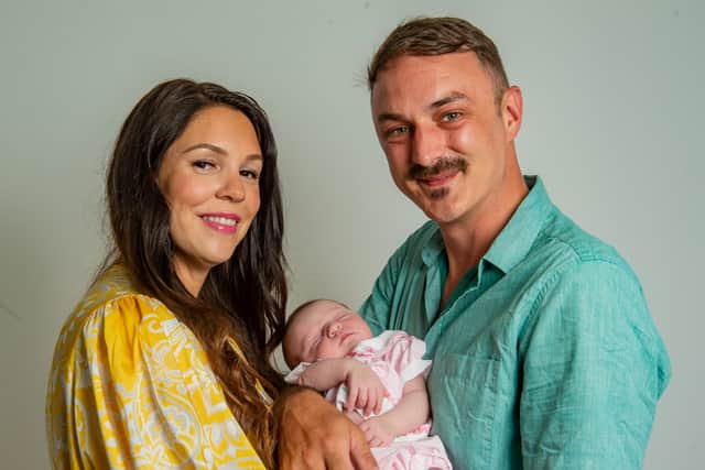 Ally Acklan and Paul Todd with baby Penelope at their home in Weston-super-Mare. 