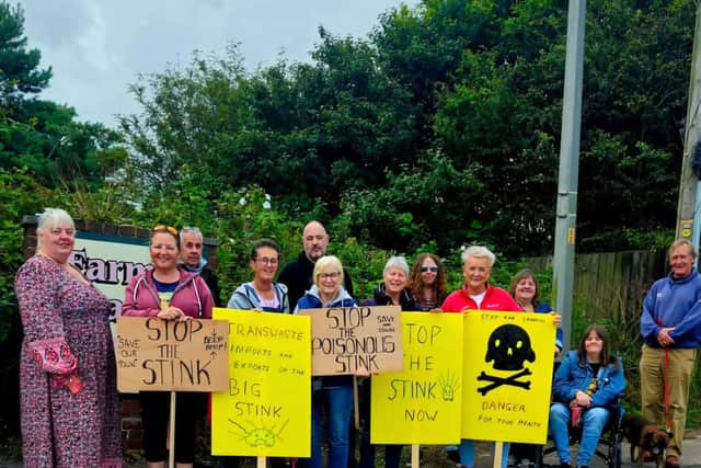 Protesters, joined by Blackpool North and Fleetwood MP Lorraine Beavers (in red) make their point outside Fleetwood's landfill site on Jameson Road.