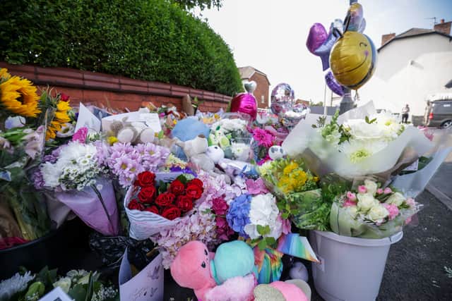 Floral tributes on the junction of Tithebarn Road and Hart Street