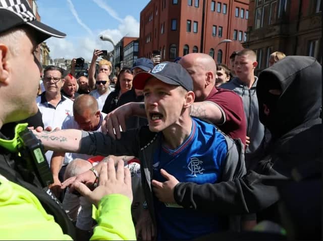 Protesters initially gathered outside Blackpool cenotaph before marching through the town. Credit: PA