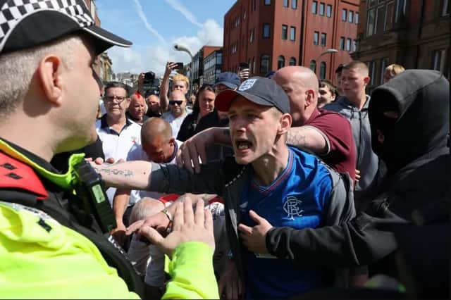 Protesters initially gathered outside Blackpool cenotaph before marching through the town. Credit: PA