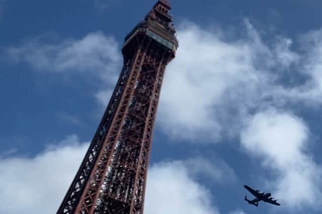Lancaster Bomber flies over the Blackpool Tower for the first time ever.