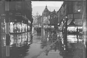 Church Street, Blackpool, close to the junction of Bank Hey Street, with the familiar sight of The Grand Theatre ( in the centre) and H Samuels (on the right)
