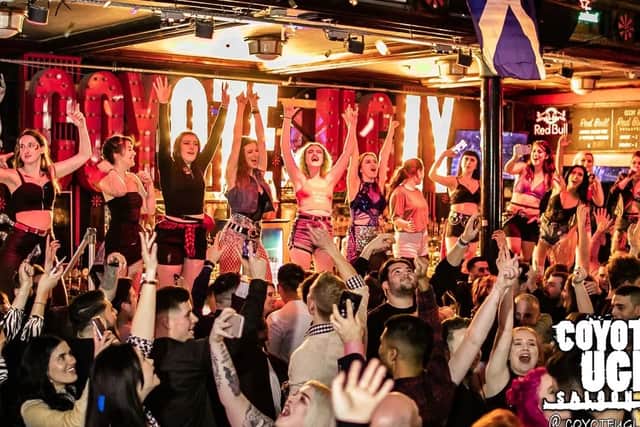 The Coyote Ugly bars, founded in New York, is known for its bartenders dancing on the bar. Credit: Coyote Ugly UK
