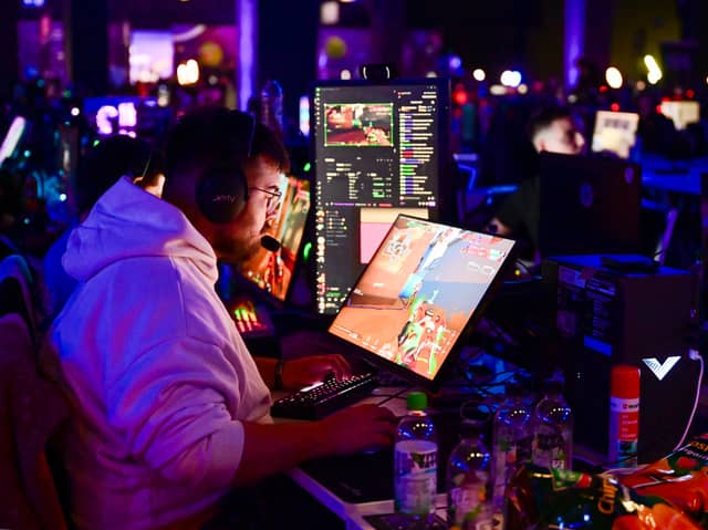 A gamer plays a video game during a Gamescom event. Photo: INA FASSBENDER/AFP via Getty Images