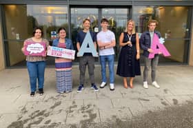 Students and their Principle Nicola Craven, celebrate their A Levels.