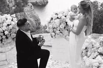 The couple in happier times when Tommy proposed in Ibiza.