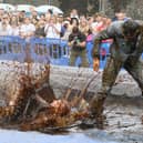 Hundreds of revellers descended on a pub garden to watch the 'world gravy wrestling championships.' 