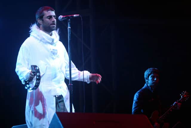 Oasis on the Pyramid Stage at Glastonbury in 2004. Photo: Matt Cardy/Getty Images