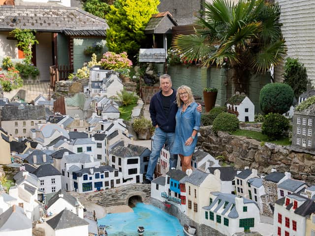 Lee and Julie Gregory with the model of Polperro in Cornwall which is now up for sale.