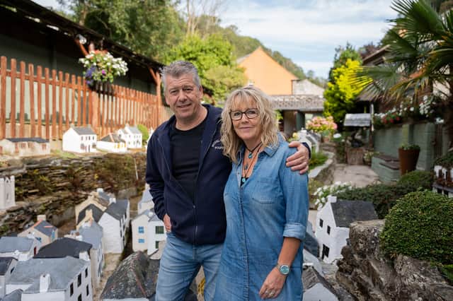 Lee and Julie Gregory in front of the model of Polperro, Cornwall, which is now up for sale.
