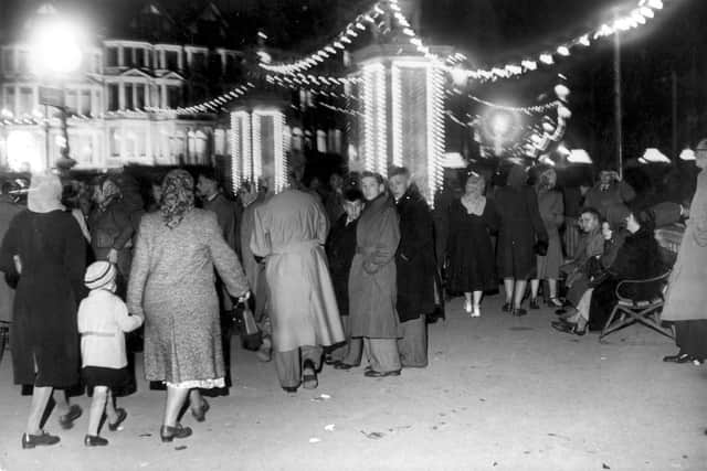 The promenade by the sunken gardens at Gynn Square were bright with lights and busy with people in this 1949 photograph