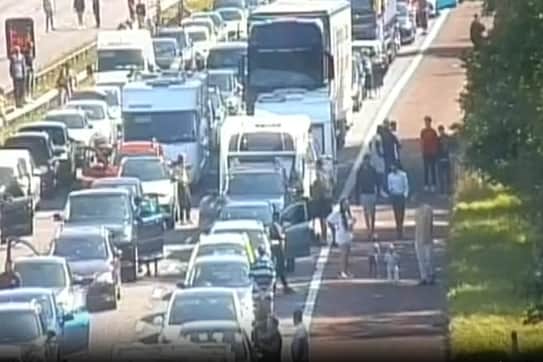 Police have warned motorists of the dangers of abandoning cars on the motorway after releasing images of children running around and playing frisbee on the M6.