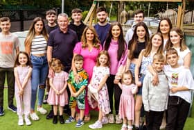 Sue and Noel Radford with some of their 22 children.