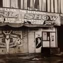 This was taken way back in 1956. The caption on the back of the photo reads 'These hoardings recall some of the shows to be seen on 'Blackpool's Golden Mile' last summer. 