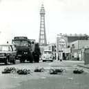 10 Giant Spiders ( currently starring in the BBC series) stop the traffic on Blackpool Promenade as they make their way to the Dr Who Exhibition in 1974