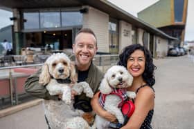 Dan Whiston with his dog Douglas and Hayley Tamaddon with her Bella outside the Beach House.