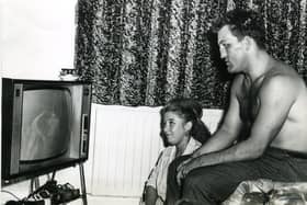 Brian London v Cassius Clay fight. Relaxing at home, Brian London sits with his wife Veronica to watch the telerecording of his fight with Cassius Clay