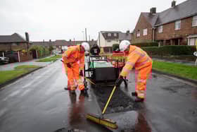 Workers repairing a pothole in Deepdale Road, Blackpool