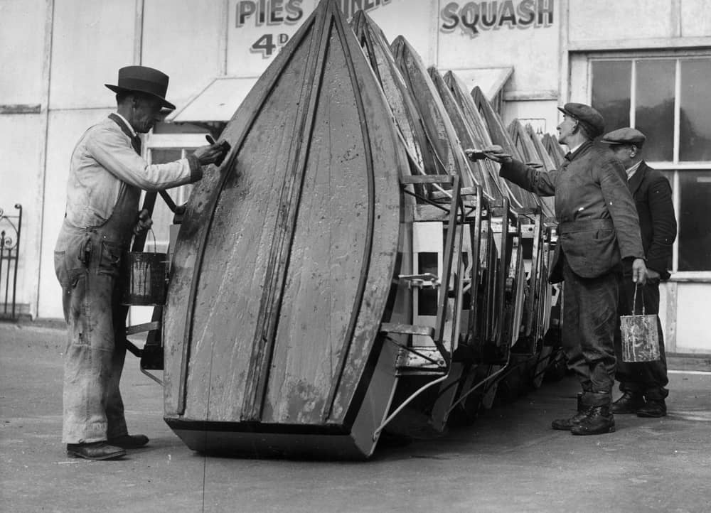 Men painting the pleasure boats at Blackpool Boating Lake,  Blackpool Pleasure Beach, Lancashire, in preparation for the Easter holiday visitors, 1936