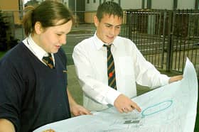 Palatine High School Geography feature. Year ten pupils Matthew Hardman and Sophie Bryce looking at the plans for the new leisure centre (pictured behind)