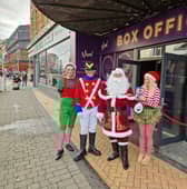 Leye D Johns as Santa and his elves outside Viva in Blackpool town centre.