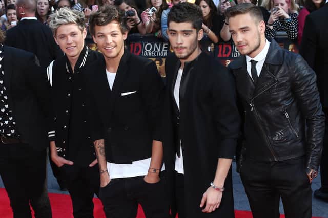 Liam (far right) pictured with his One Direction family. 