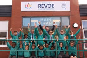 The headteacher and pupils at Revoe Learning Academy celebrate their latest Ofsted report.