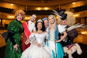 The full Cinderella panto cast dressed as their characters.
