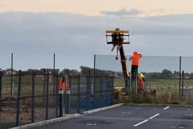 The new fence around the perimeter of the airport reportedly stands 9ft 8inches and obscures the view of aviation enthusiasts and photographers. Credit: Blackpool Airport Supporters