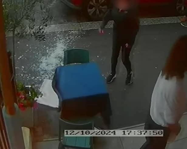 Video grab from this shocking footage shows an alleged attack on restaurant staff - in a dispute over paying a bill  at La Bella Vista in Hastings, East Sussex.