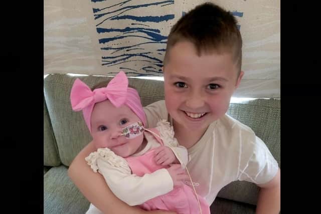 Little Grace Thorpe with her old brother, Rowan