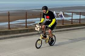 Paddy caught cycling down Blackpool Promenade.