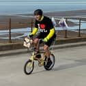 Paddy caught cycling down Blackpool Promenade.