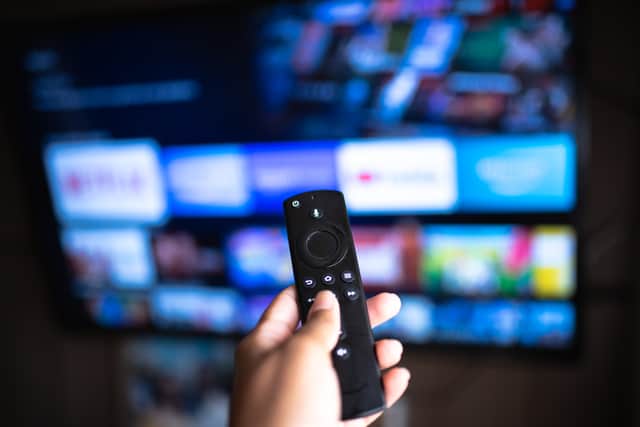 Person using an Amazon Fire TV Stick. Photo: Anna Quelhas - stock.adobe.com
