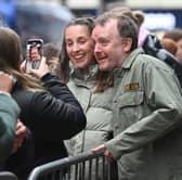 Comedian Chris McCausland poses with fans