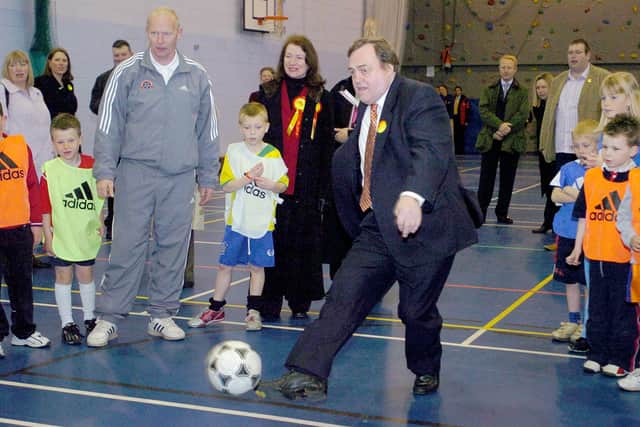 John Prescott took part in a penalty shoot out during a visit to Fleetwood High School with Joan Humble watching on