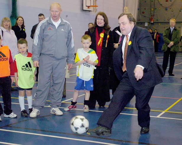 John Prescott took part in a penalty shoot out during a visit to Fleetwood High School with Joan Humble watching on