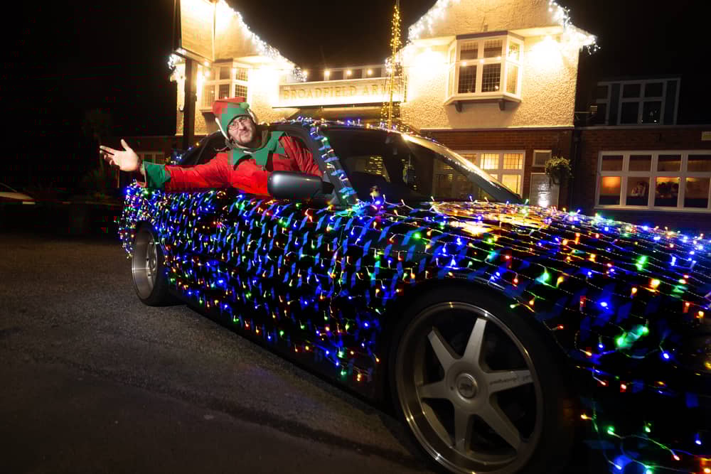 Steven Buck's dazzlingly festive BMW lit up outside the Broadfield Arms pub in Leyland